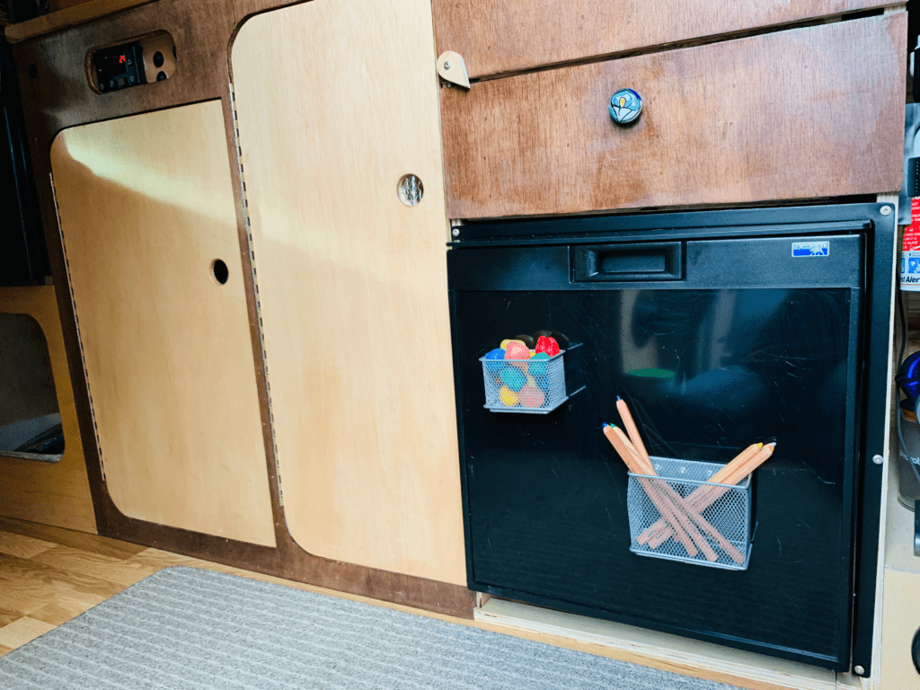 The Container Store magnetic mesh bins on van fridge organizing kid crafts