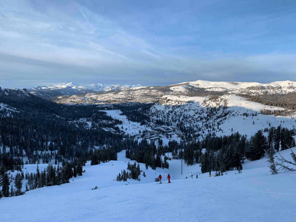 Kids skiing at Kirkwood Ski Resort on a sunny Christmas day after a big snowstorm