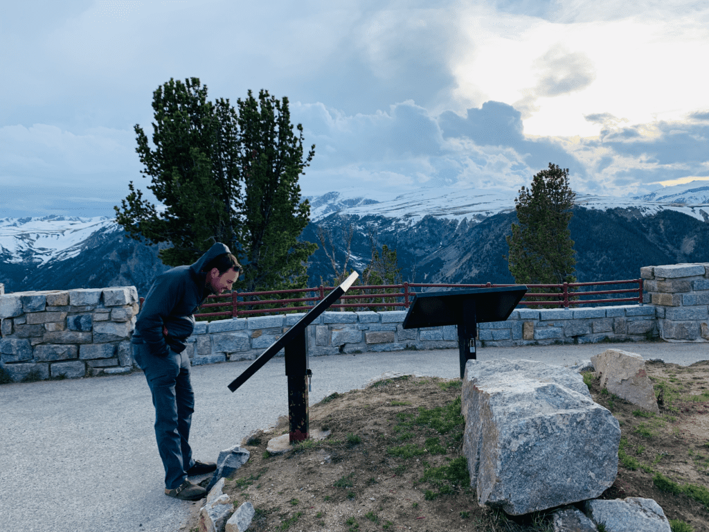 Driver learning about how challenging Beartooth Pass is at the summit on Beartooth Highway