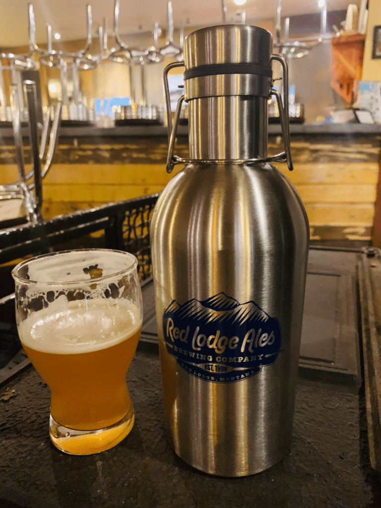 Red Lodge Ales Brewing Company Stainless Steel Growler and cold beer