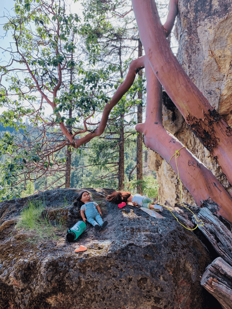 Dolls on a rock while family rock climbing in the Rogue Valley