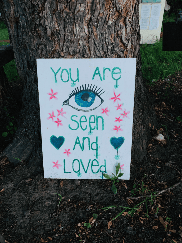 You are Seen and Loved sign with tree in background