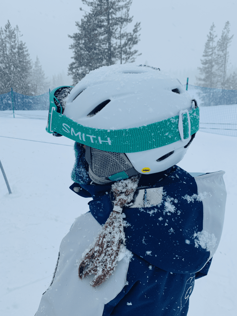 Kid Hair Hoarfrost on a storm day at Mount Bachelor wearing MBSEF team jacket with white snow and white stormy skies in the background