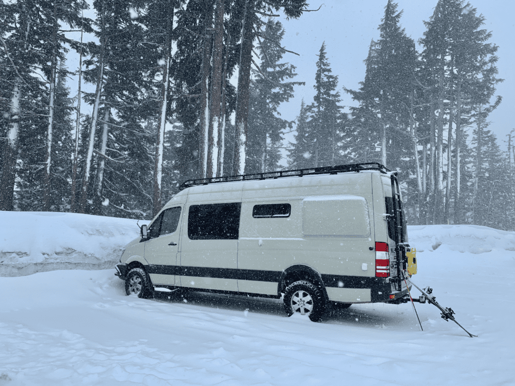 Van at Mt Bachelor Spring Storm in Bend with white snow frosted trees in the background