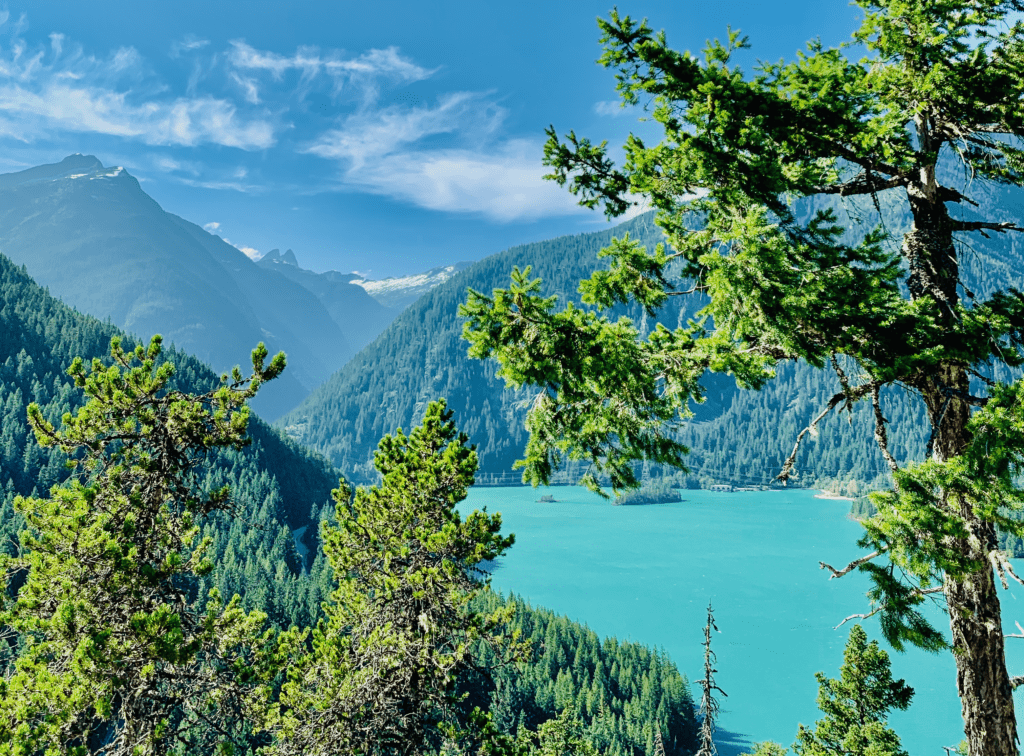 North Cascades National Park Diablo Lake magnificent green blue brilliant waters with blue skies and snow capped mountains in the background